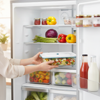 Hands placing in refrigerator